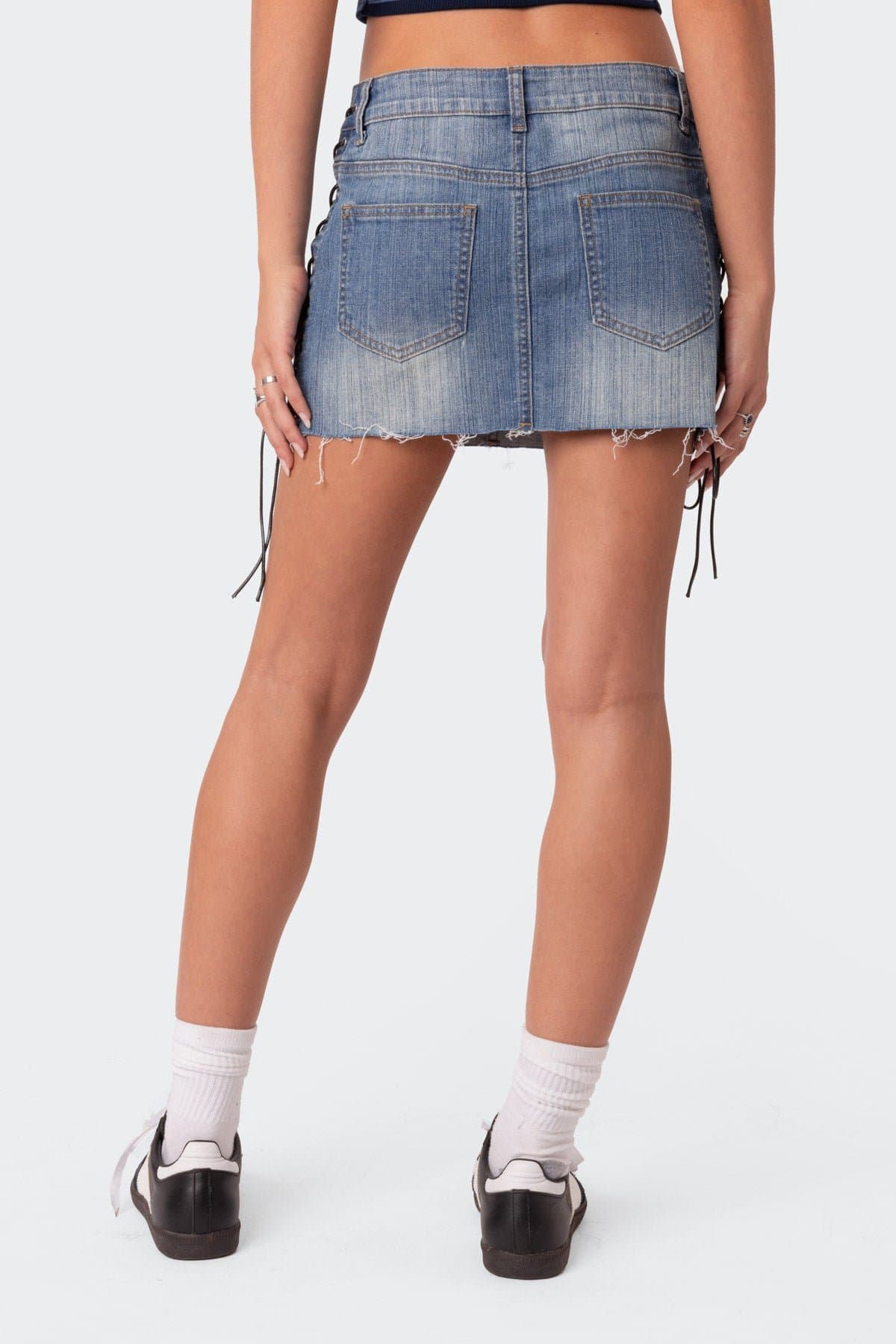 Side Lace Up Denim Mini Skirt in Cotton Spandex with Raw Hem