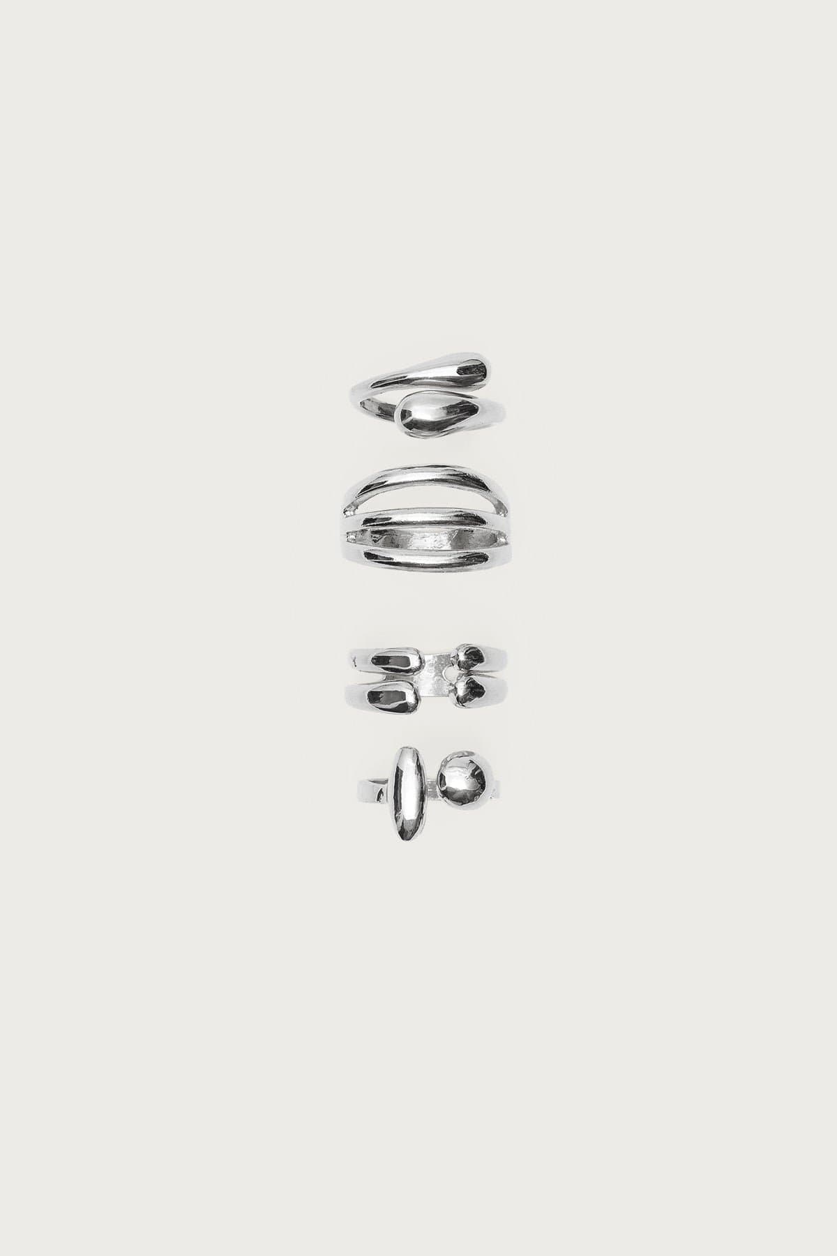 Mixed Ring Pack - 4 Assorted Styles Silver Tone Metal 0.7-0.8in Diameter