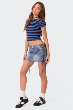 Side Lace Up Denim Mini Skirt in Cotton Spandex with Raw Hem