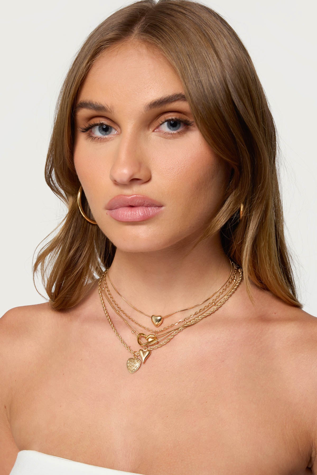 Layered Heart Pendant Necklace in Gold Tone Metal